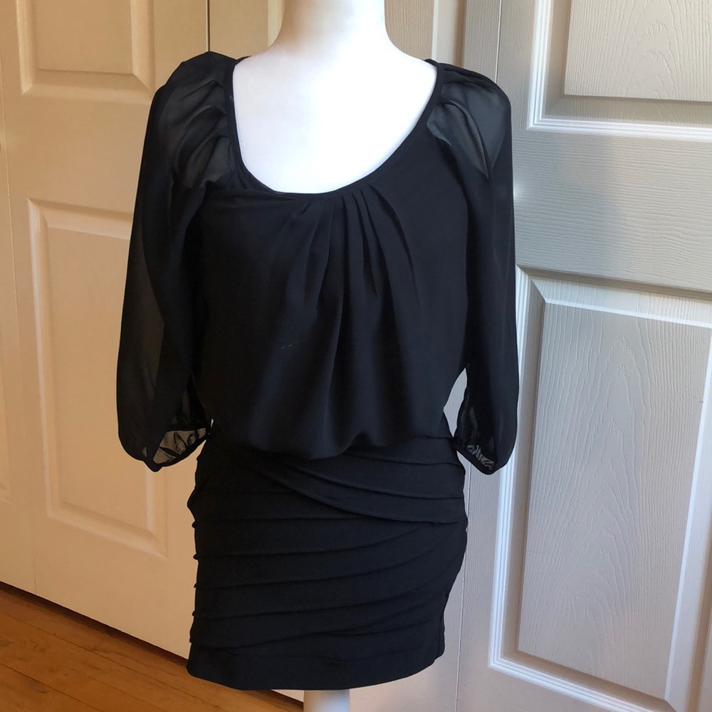Women’s black pencil skirt dress.